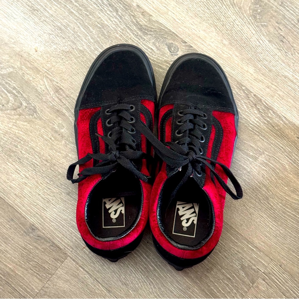 Black with red velvet Vans